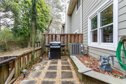 a backyard of a house with outdoor seating