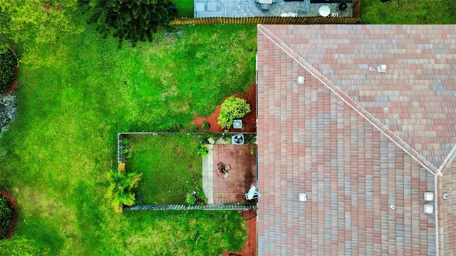 a backyard of a house with lots of green space