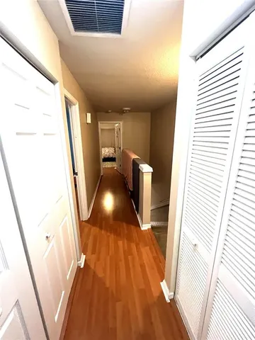 a view of entryway with wooden floor