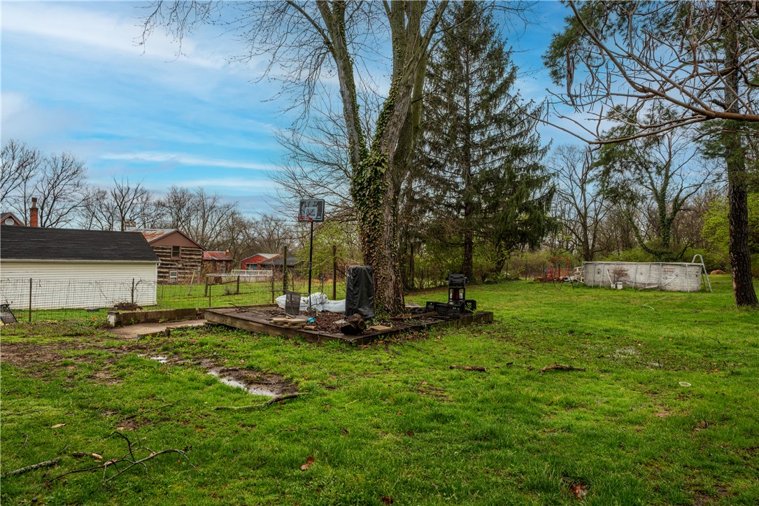 106 Burton Road Middletown, OH 45044 - Photo 4 of 7 This spacious yard offers a vibrant green landscape and ample room for outdoor activities.