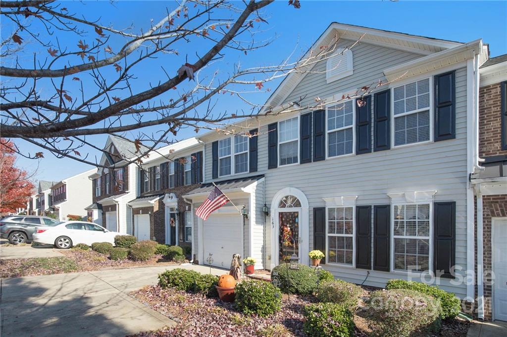 163 Snead Road Fort Mill, SC 29715 - Photo 3 of 33 a front view of a house with a garden