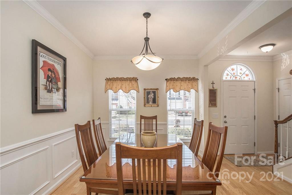 163 Snead Road Fort Mill, SC 29715 - Photo 5 of 33 a view of a dining room with furniture window and wooden floor