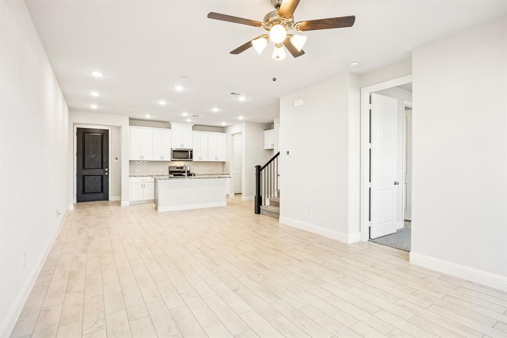 817 Heart Reef Road Plano, TX 75075 - Photo 12 of 21 a view of a kitchen with a sink and a refrigerator