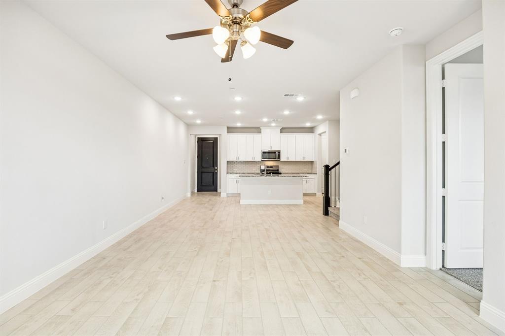 817 Heart Reef Road Plano, TX 75075 - Photo 13 of 21 a view of a kitchen with a sink and a refrigerator