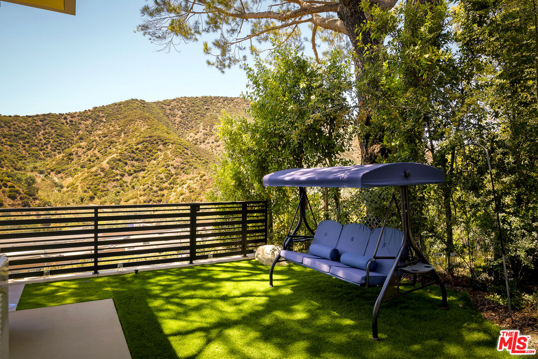 1367 Casiano Road Los Angeles, CA 90049 - Photo 26 of 26 a view of a chairs and table in the patio