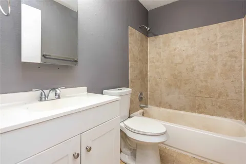 a bathroom with a sink a toilet and a bathtub