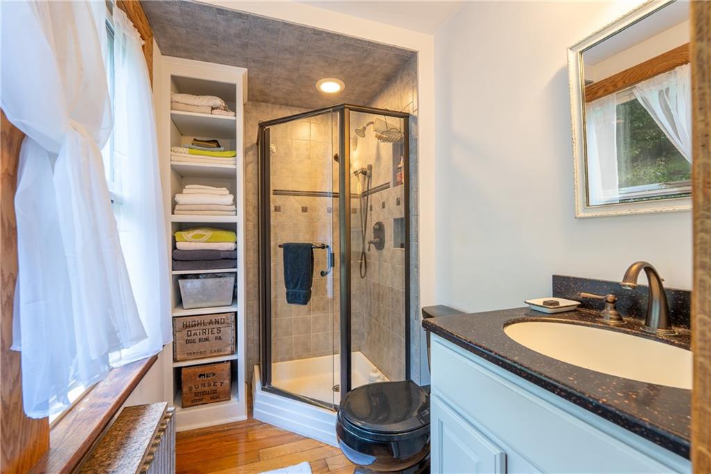 652 Tub Mill Run Road West Salisbury, PA 15565 - Photo 13 of 48 a spacious bathroom with a granite countertop sink and a mirror