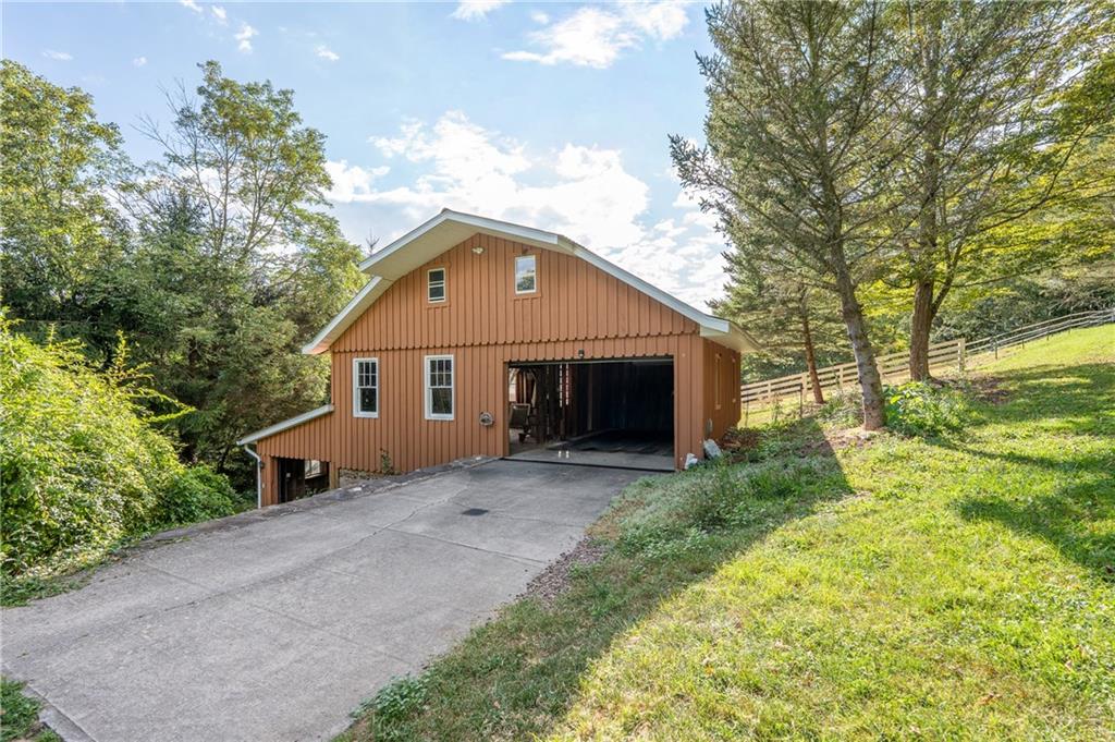 652 Tub Mill Run Road West Salisbury, PA 15565 - Photo 33 of 48 a front view of a house with a yard and garage