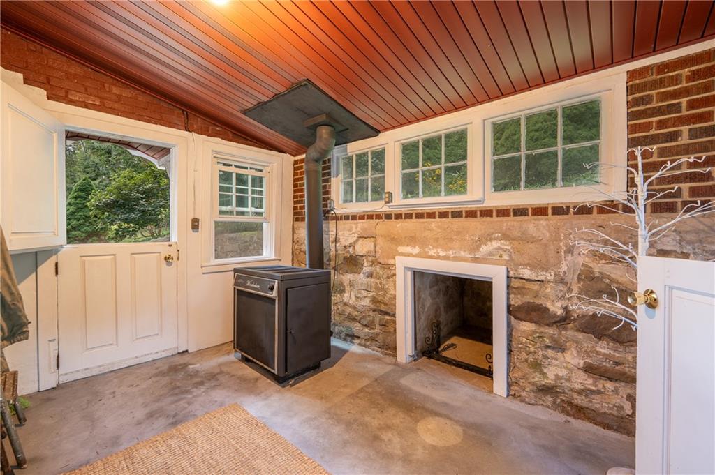 652 Tub Mill Run Road West Salisbury, PA 15565 - Photo 4 of 48 a view of an empty room with a fireplace and a window