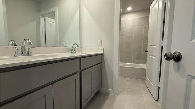 a bathroom with a sink and mirror