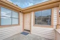 a view of a door and a window