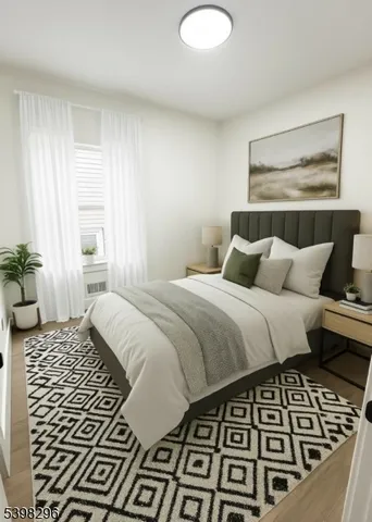 a bedroom with a bed and a couch