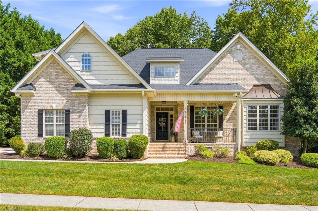 5718 Mabe Drive Oak Ridge, NC 27310 - Photo 2 of 46 Welcome Home! 5718 Mabe Dr featuring all brick, covered front porch, new 2026 roof!