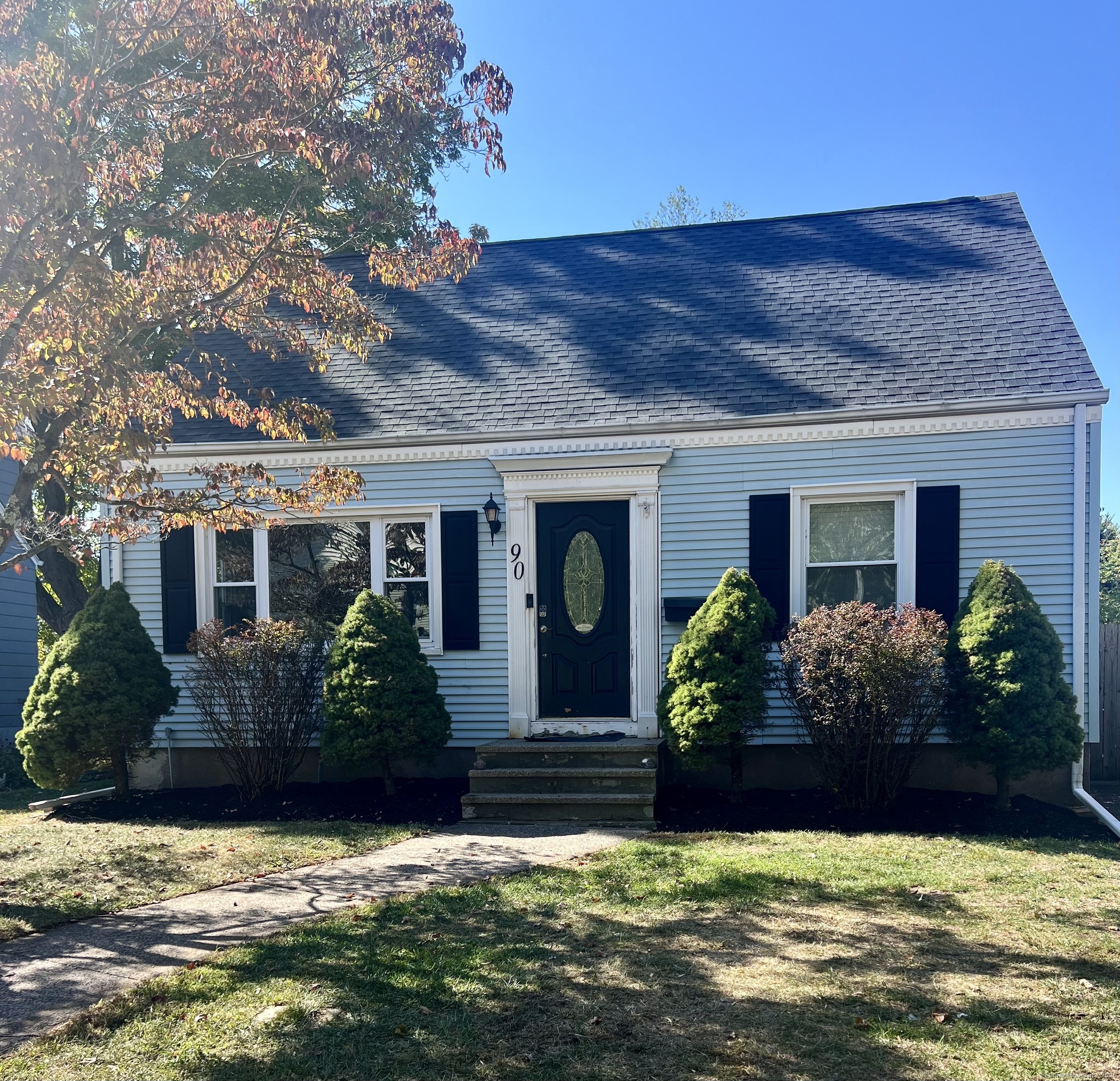 a front view of a house with a yard