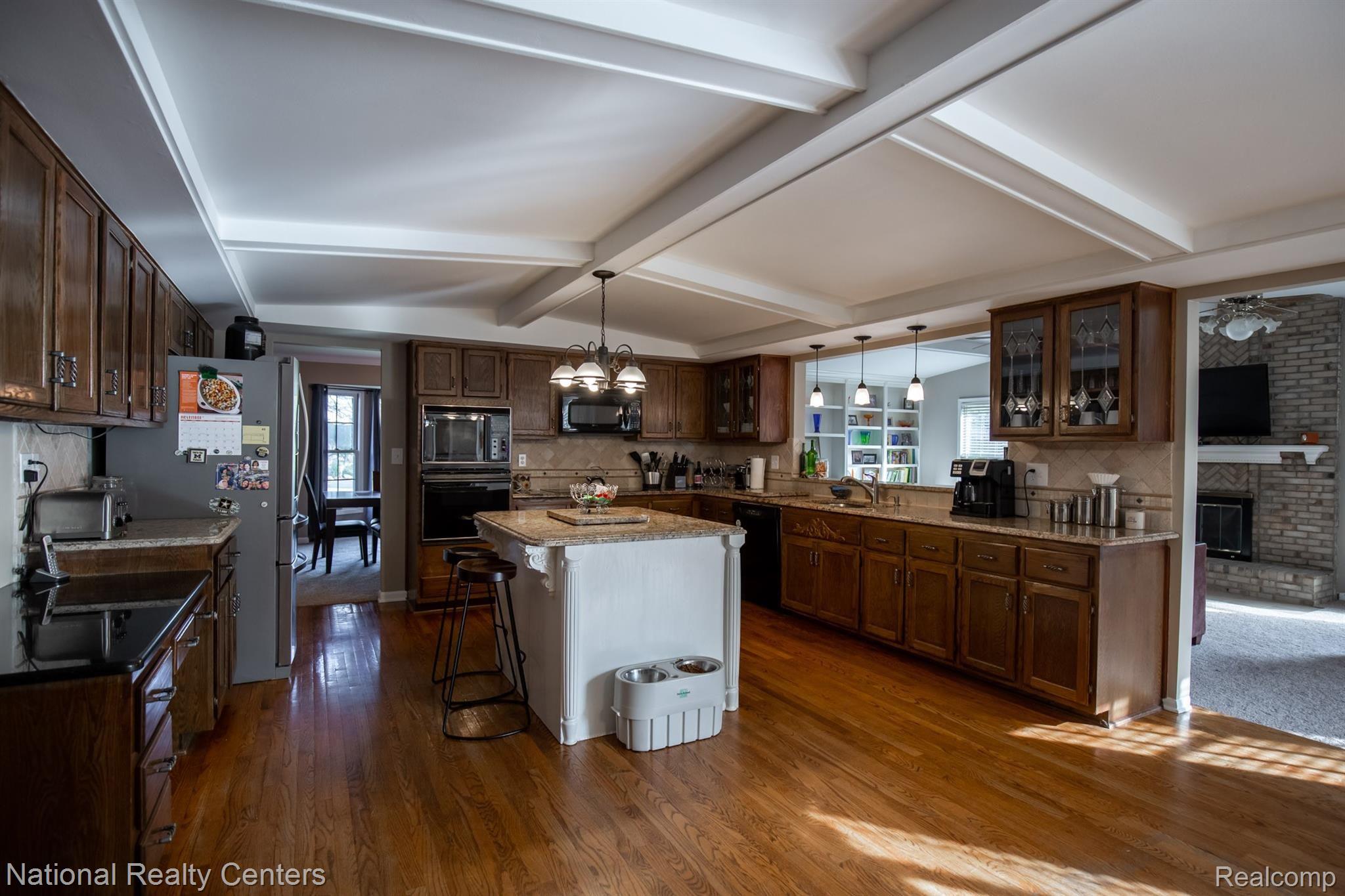 3035 Quail Ridge Circle Rochester, MI 48309 - Photo 10 of 54 Kitchen with granite countertops and large island