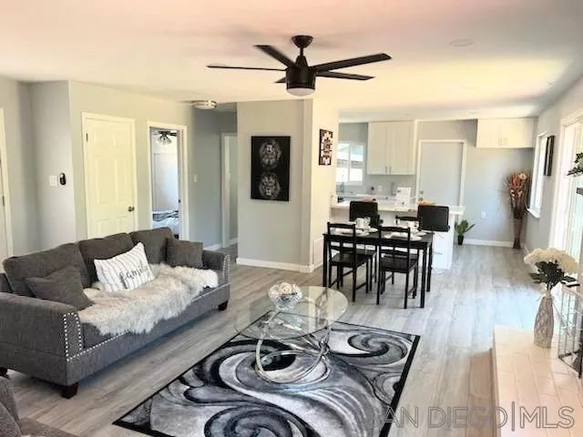 1050 Tiger Tail Road Vista, CA 92084 - Photo 18 of 28 a living room with furniture and wooden floor