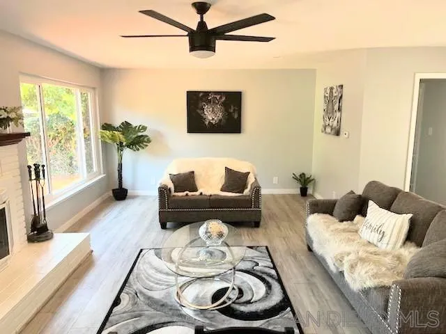 1050 Tiger Tail Road Vista, CA 92084 - Photo 19 of 28 a living room with furniture and a large window