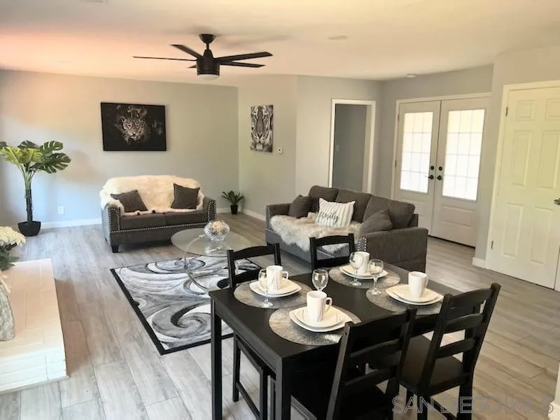 1050 Tiger Tail Road Vista, CA 92084 - Photo 21 of 28 a view of a dining room with furniture and wooden floor