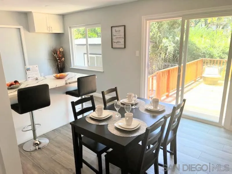 1050 Tiger Tail Road Vista, CA 92084 - Photo 23 of 28 a view of a dining room with furniture and wooden floor