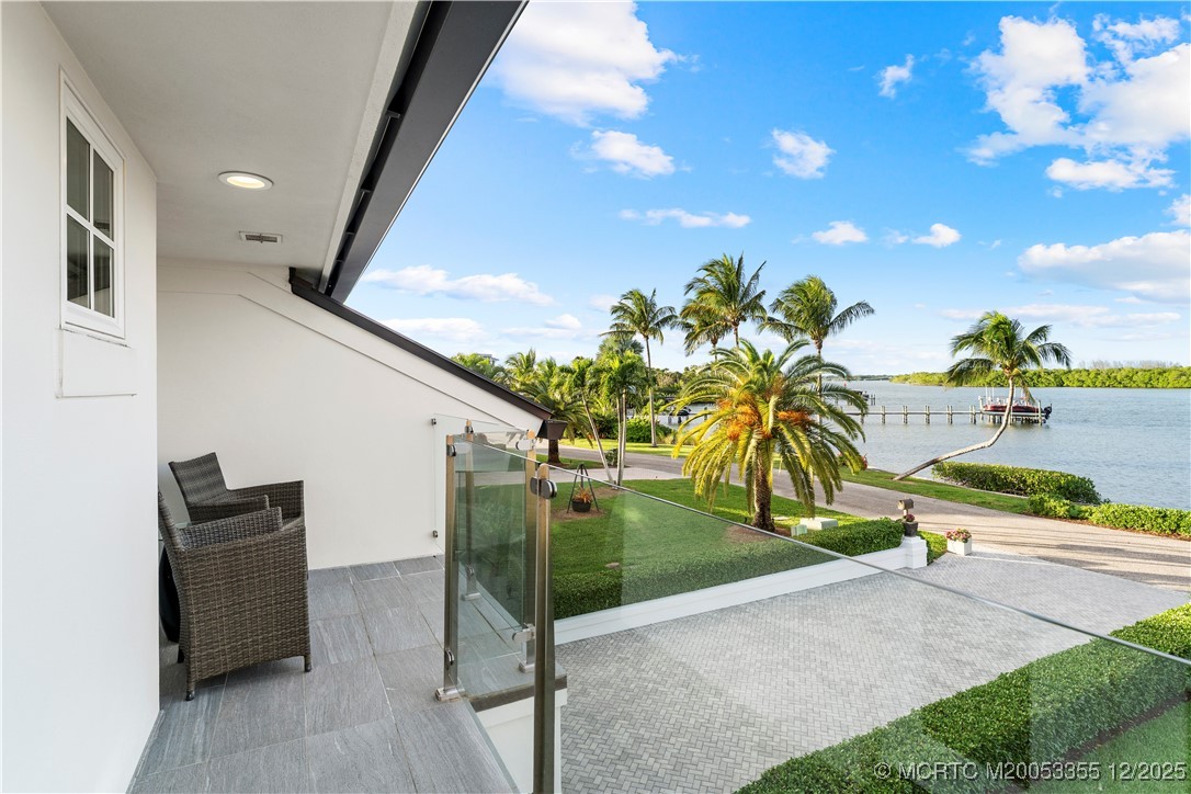 6026 Southeast Horseshoe Point Road Stuart, FL 34997 - Photo 31 of 44 Patio off the Primary Ensuite
