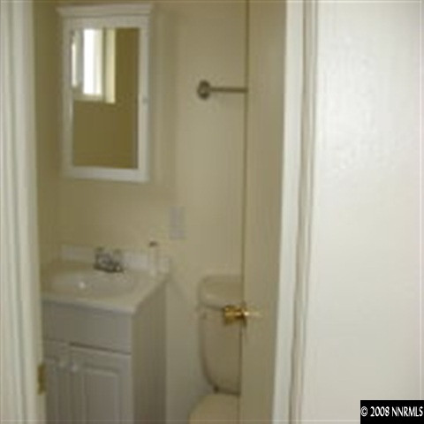 1850 Citron Street Reno, NV 89512 - Photo 2 of 9 a bathroom with a sink and mirror