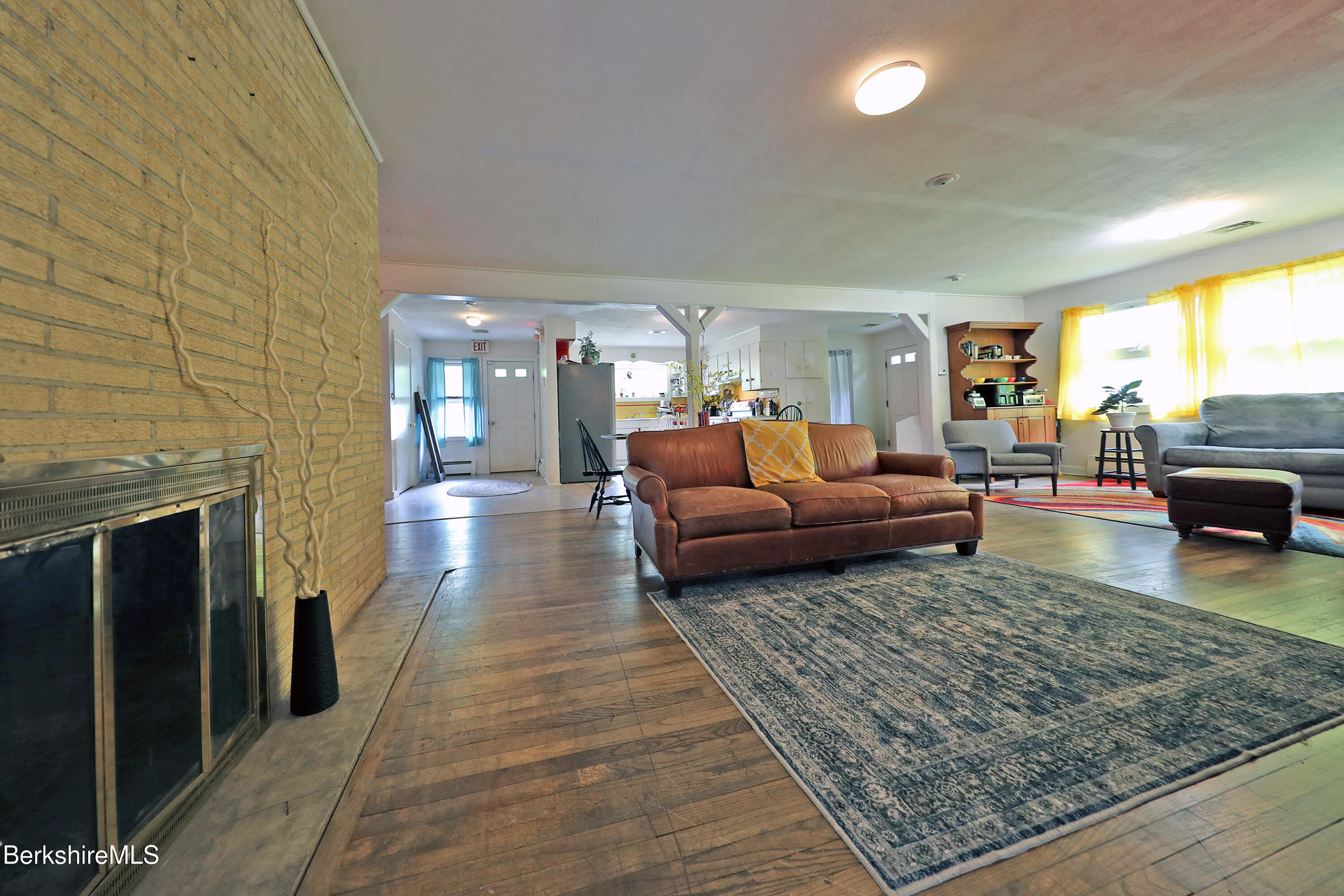458 Monterey Road Great Barrington, MA 01230 - Photo 12 of 36 a living room with furniture and a fireplace