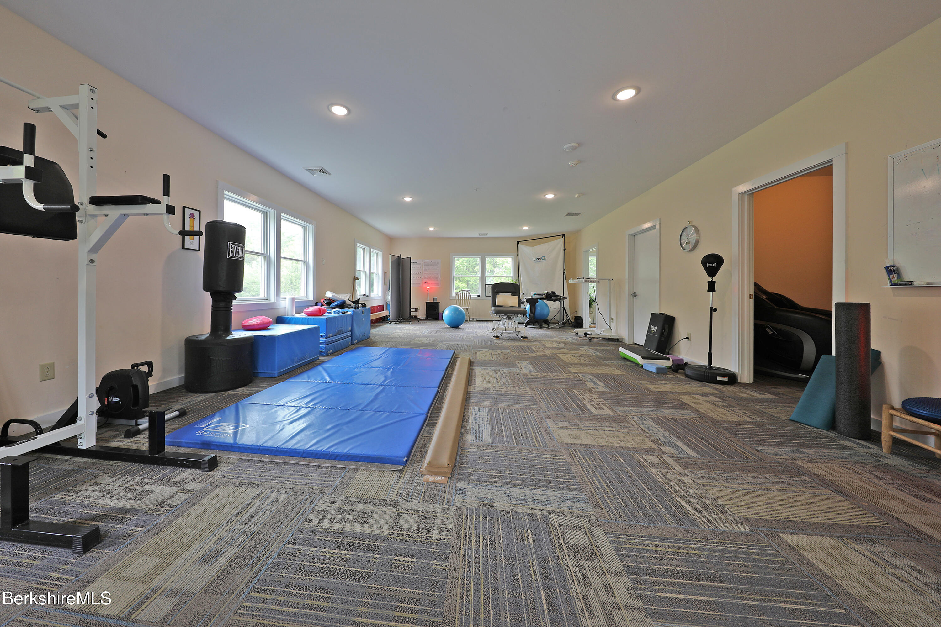 458 Monterey Road Great Barrington, MA 01230 - Photo 32 of 36 a living room with furniture and a fireplace