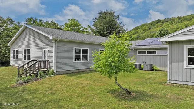a view of a house with backyard