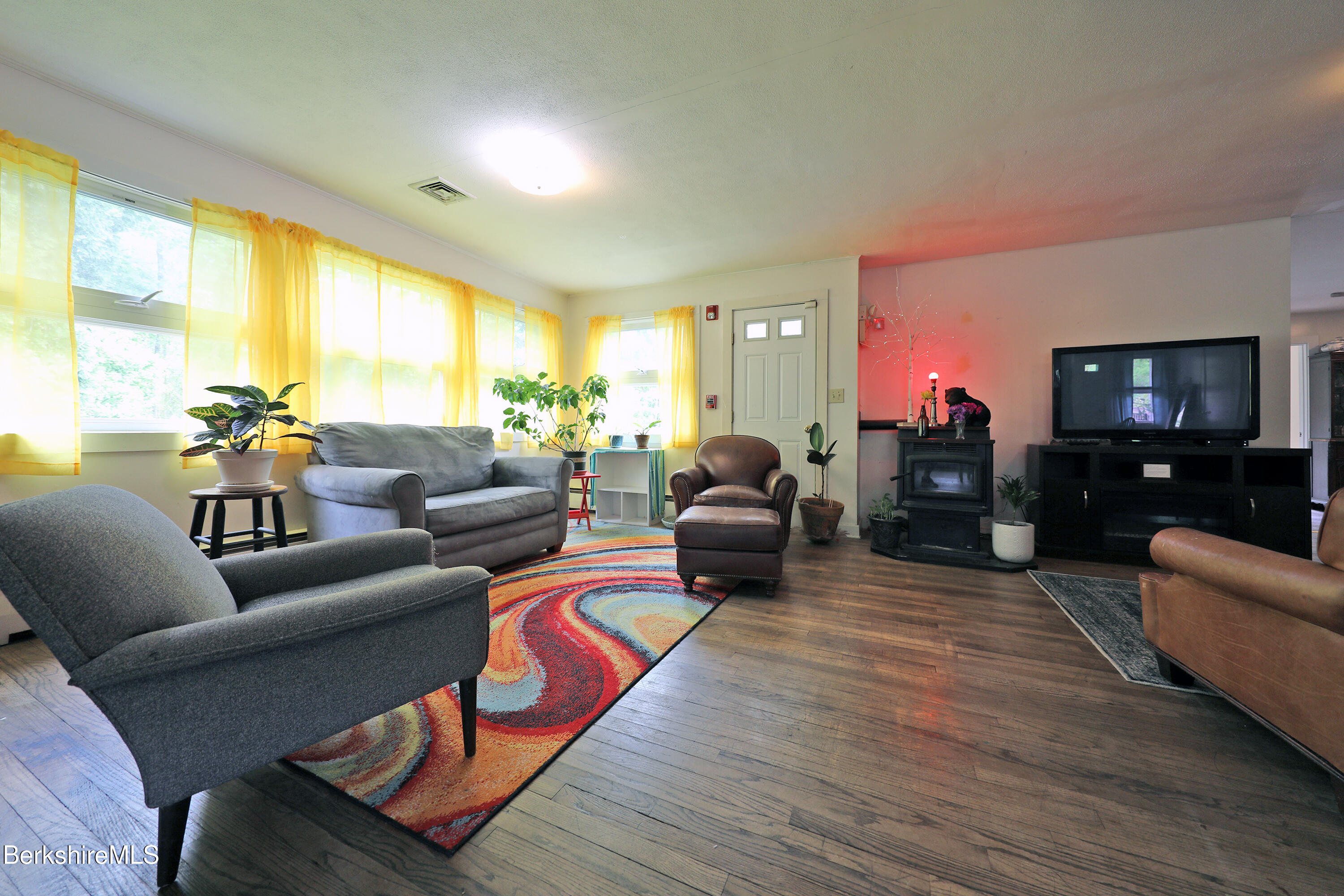 458 Monterey Road Great Barrington, MA 01230 - Photo 8 of 36 a living room with furniture and a flat screen tv