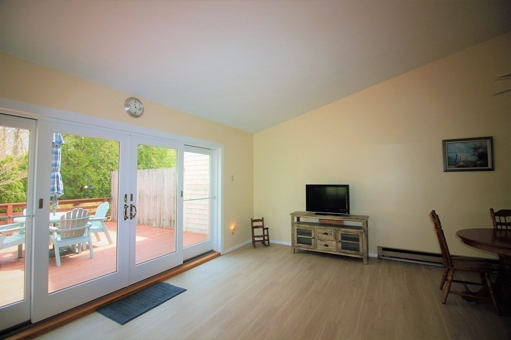 30 Round House Road, Unit 30 Bourne, MA 02532 - Photo 12 of 19 a view of a livingroom with furniture and a flat screen tv