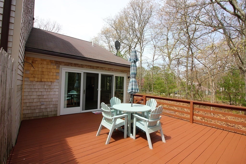 30 Round House Road, Unit 30 Bourne, MA 02532 - Photo 14 of 19 a patio with table and chairs