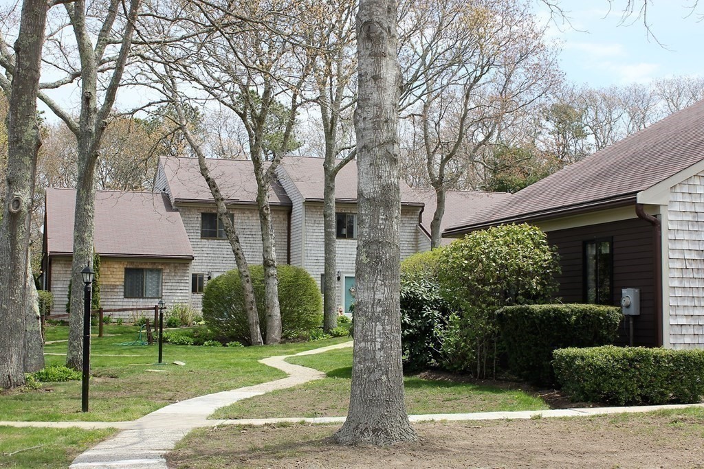 30 Round House Road, Unit 30 Bourne, MA 02532 - Photo 16 of 19 a front view of a house with garden