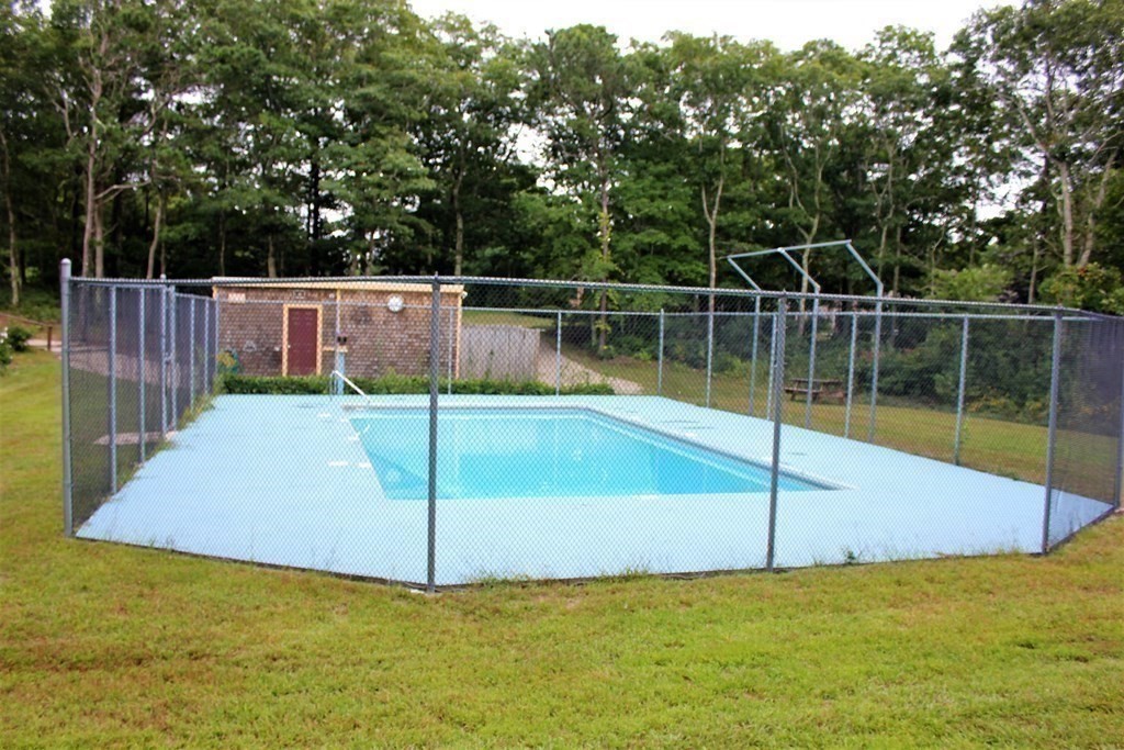 30 Round House Road, Unit 30 Bourne, MA 02532 - Photo 17 of 19 a view of a backyard with swimming pool