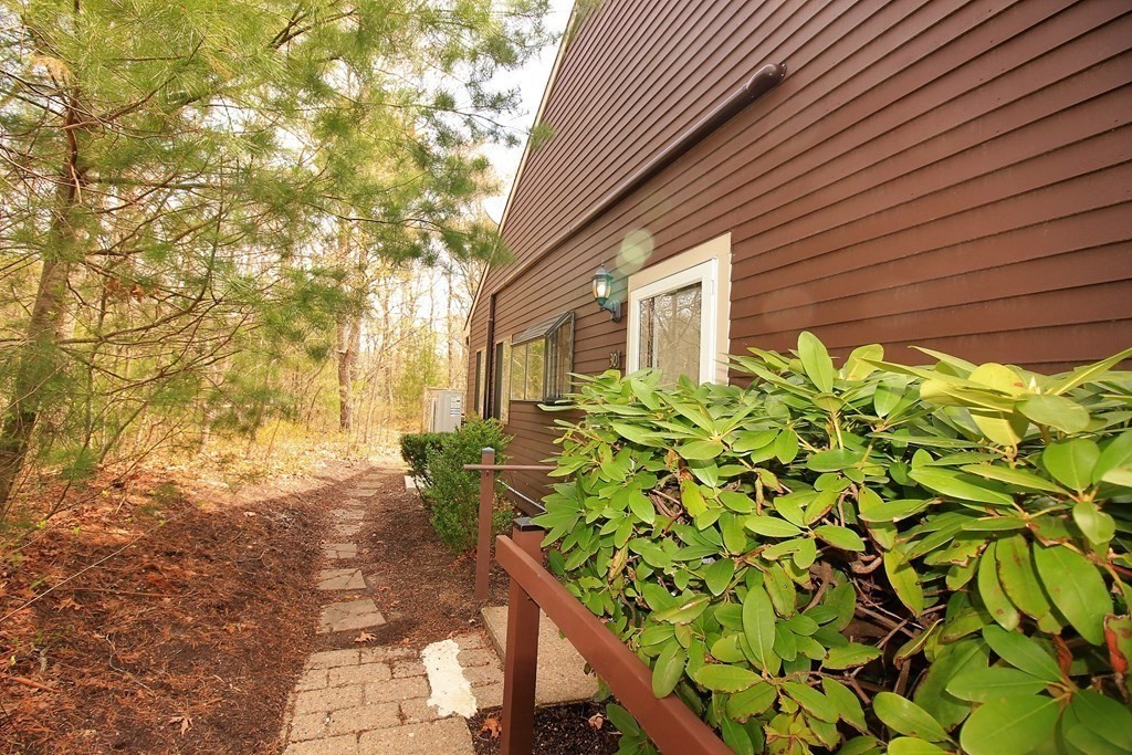 30 Round House Road, Unit 30 Bourne, MA 02532 - Photo 2 of 19 a backyard of a house with lots of green space