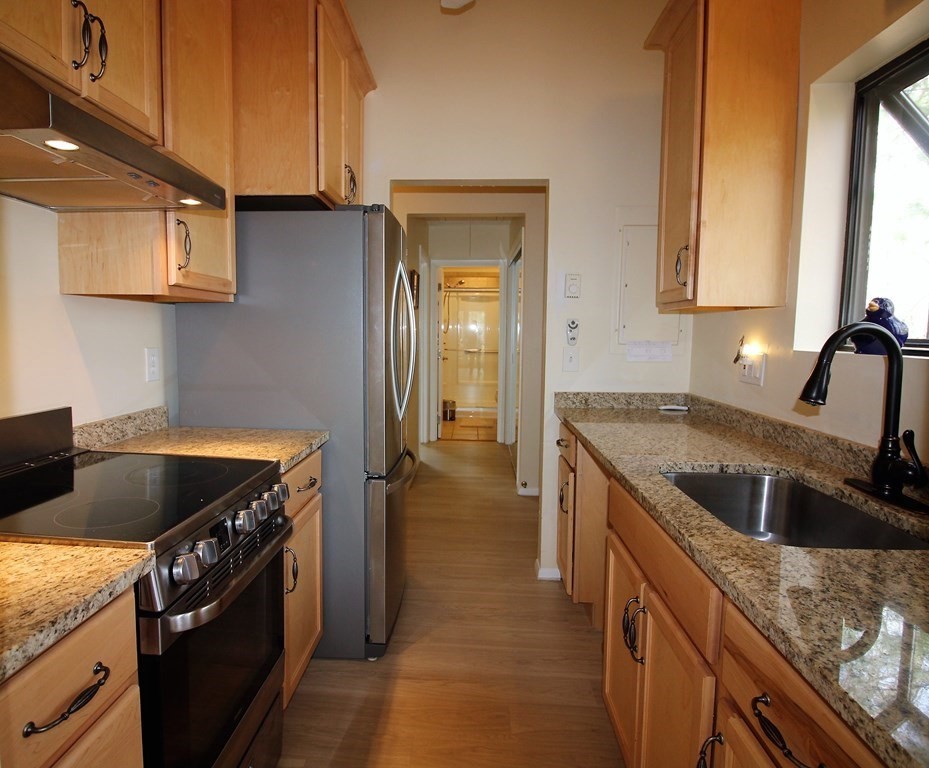 30 Round House Road, Unit 30 Bourne, MA 02532 - Photo 4 of 19 a kitchen that has a sink and a stove
