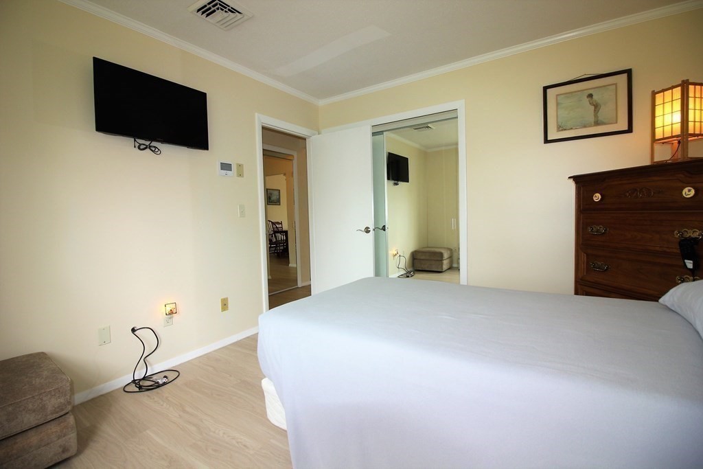 30 Round House Road, Unit 30 Bourne, MA 02532 - Photo 7 of 19 a big room with closet and a flat screen tv