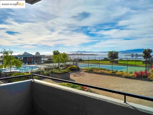 an aerial view of a house with a lake view