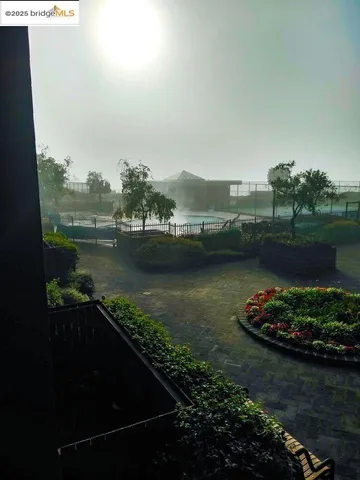 a view of a swimming pool with a patio