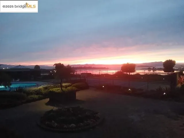 a view of a pathway in front of a building