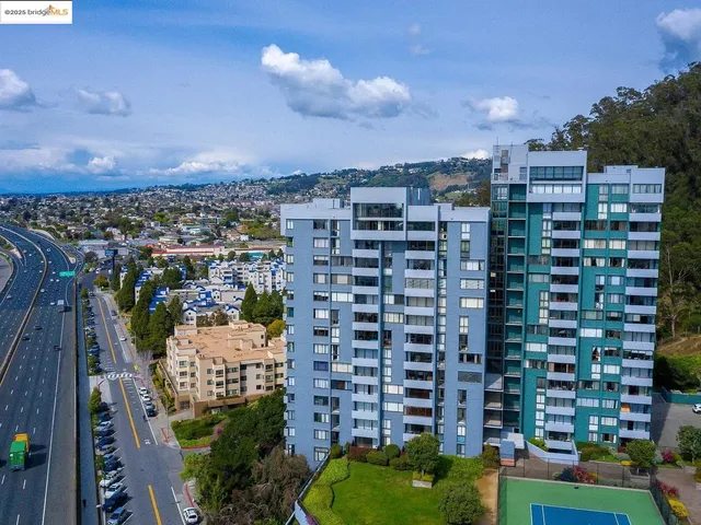 a view of a large building with a lot of flower plants
