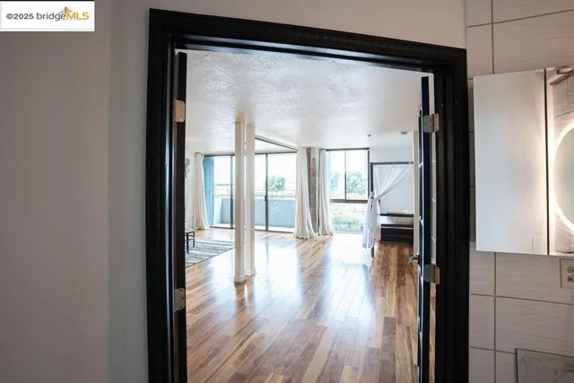 a view of gallery with wooden floor