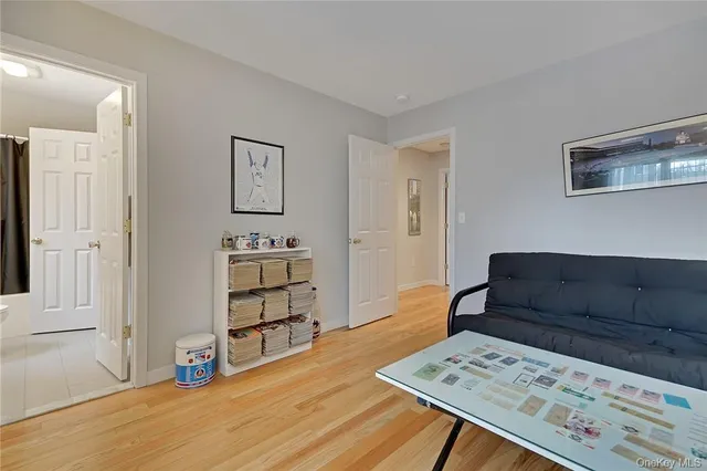 a bedroom with furniture and a wooden floor