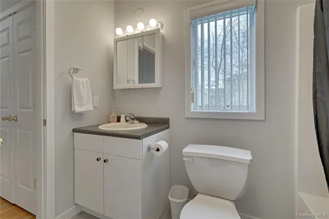 a view of a workspace with furniture and a kitchen