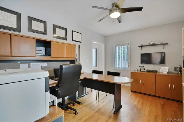 a view of a workspace with furniture