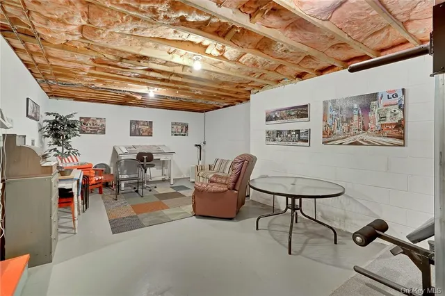 a view of a house with snow on the road