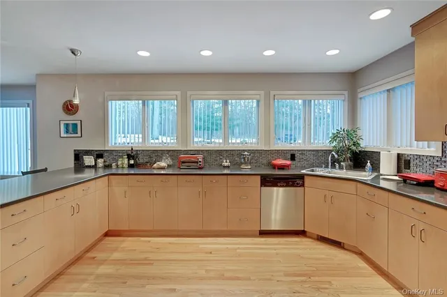 a kitchen with a sink and cabinets