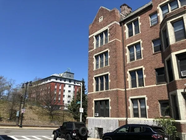 a view of a building next to a yard