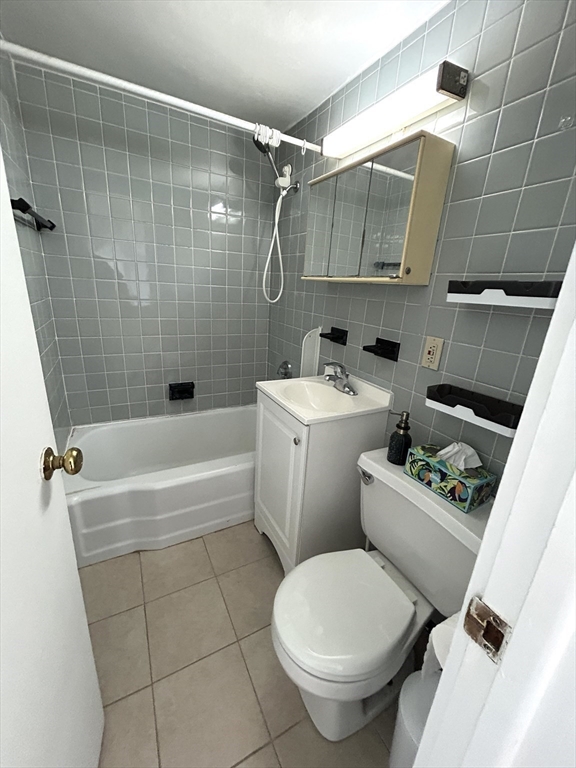4 Commonwealth Court, Unit 17 Boston, MA 02135 - Photo 7 of 15 a bathroom with a toilet sink and shower