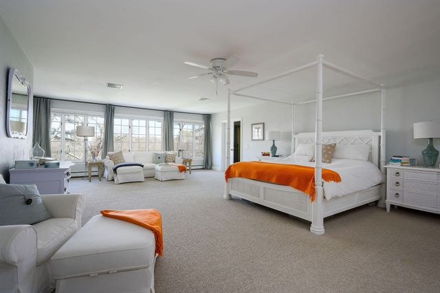 a living room with furniture a window and gym equipment