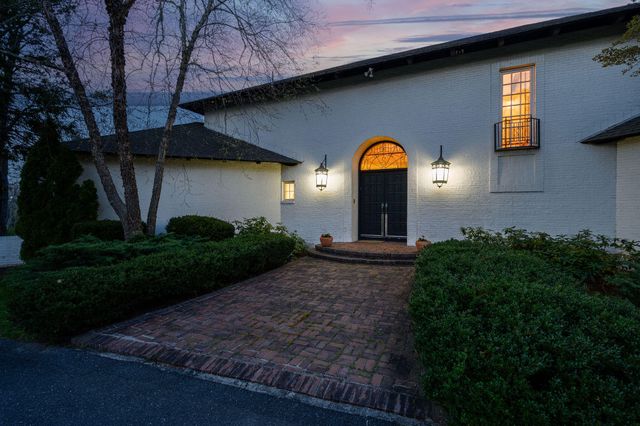 a view of a backyard with sitting area